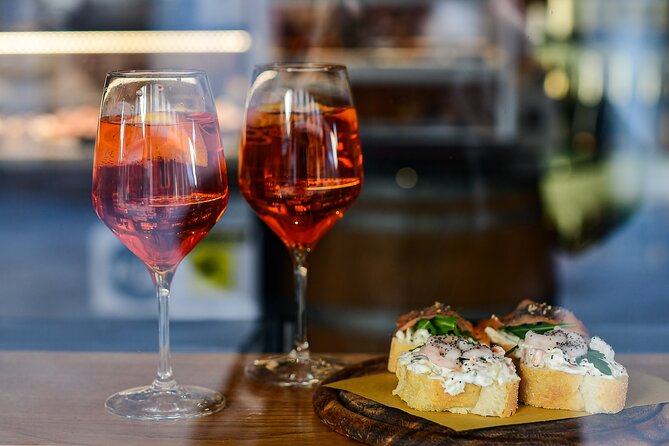 Turin: Sunset Food & Drinks Tour by Do Eat Better - Stop 1 on Via Giuseppe Luigi Lagrange: Piedmont Wine in a Central Wine Shop