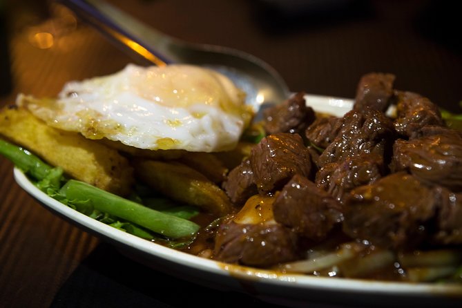 Ultimate Phnom Penh Food Tour by Tuk Tuk: 20 Tastings and Drinks - Stop 4 Russian Market At Night: Smoky, Sticky Pork Ribs