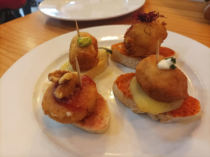 Valencia: Authentic Tapas & Drinks with a Local - Market flavors: ham and cheese where the Mediterranean smell starts