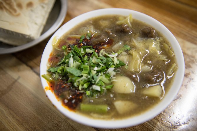 Xi'an Evening Food Tour by TukTuk - Muslim Quarter first: tasting where specialties are made