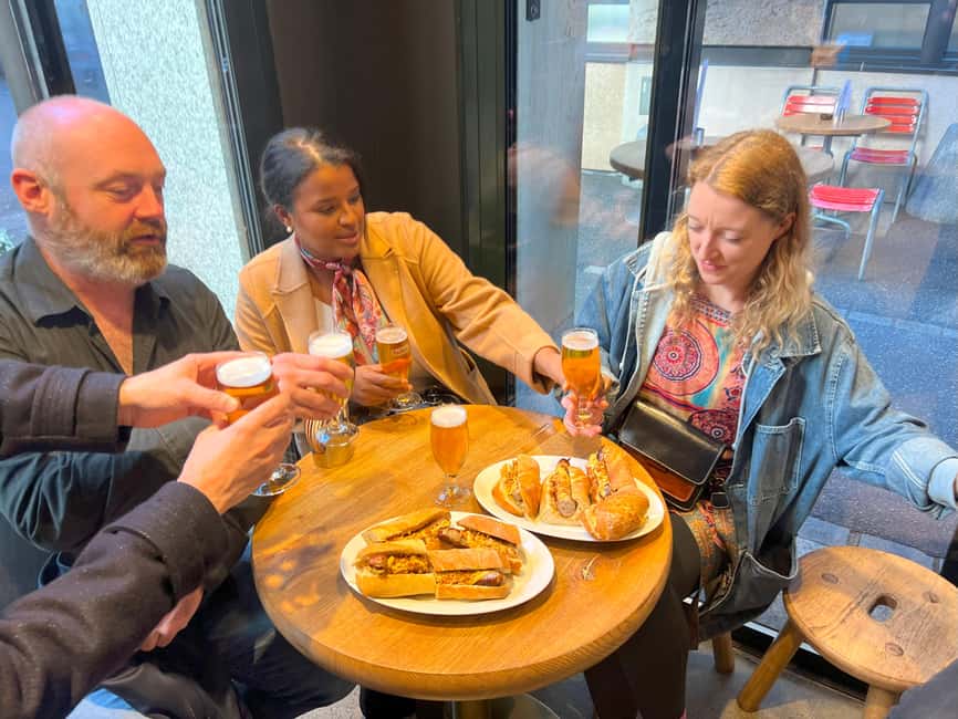 Zurich: Food Tour of 8+ Tastings with Cheeses & Chocolates - Chasing cheese: cheesemonger tasting, schnaps, and Chäschüechli